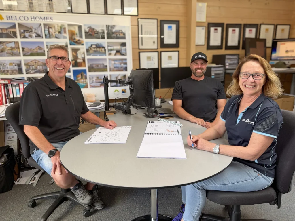 Mike, Kathy and Kerry of Belco Homes around the table in the office